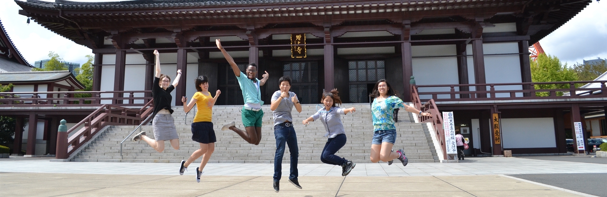 students jumping in Japan
