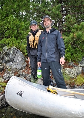 Author and friend with canoe