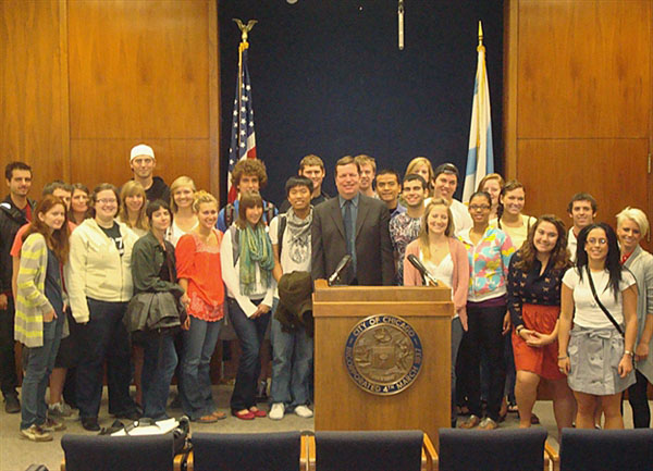 Joe Moore and students at City Council chamber